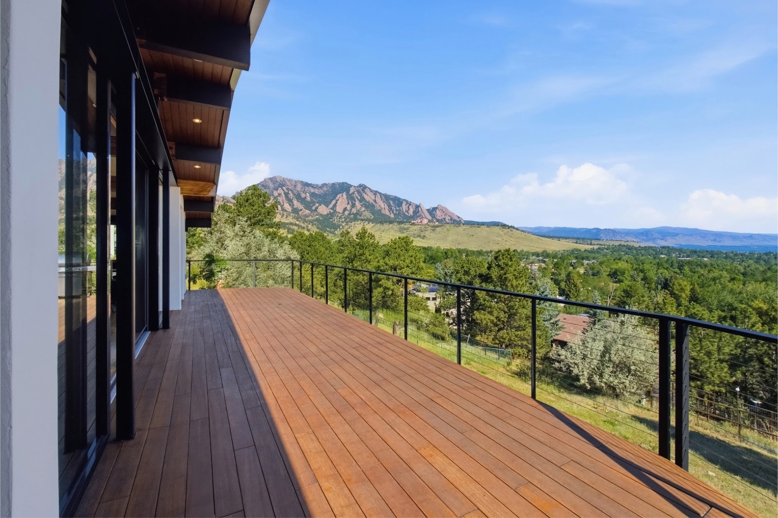 The Flatirons seen from the deck of a VelareLX residence above Boulder